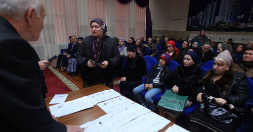 Giving out "genetic passports" to the relatives of the kidnapped residents of Chechnya. Grozny, March 2015. Photo by Kazbek Vakhaev http://www.grozny-inform.ru/news/society/58610/