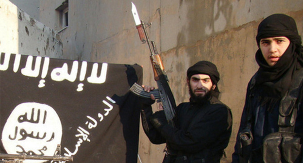 IS supporters near the "Islamic State" flag (Islamic State is a terrorist organization banned in Russia). Photo by user Vesti Detalno, www.flickr.com