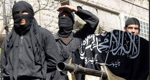 IS supporters hold Islamic State flag (Islamic State is a terrorist organization banned in Russia). Photo by user Chief Editor, www.flickr.com