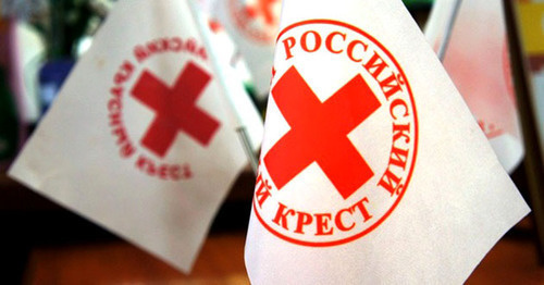 Flags with logo of International Red Cross. Photo: http://www.novorosinform.org/news/id/29120