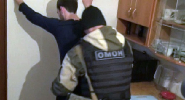 The detention of one of the suspected residents of the city of Pallasovka. Screenshot of a record made by the law enforcers, Vesti.ru
