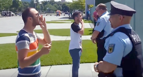 Khabib Munteziri (left) calls on Ilham Aliev to release political prisoners in Azerbaijan, June 7m 2016. Photo: screenshot of YouTube video. 