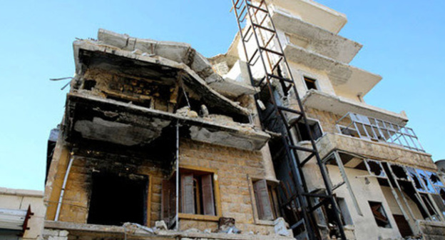 A destroyed building in Aleppo. Syria. Photo by the user IHH Humanitarian Relief Foundation https://www.flickr.com
