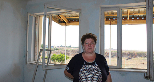 A resident of Martakert near her house. Photo by Alvard Grigoryan for the "Caucasian Knot"