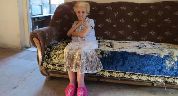 Refugee from Baku Isabella Stepanyan has been living in unfinished house near Stepanakert since 1997, Nagorny Karabakh, August 2016. Photo by Alvard Grigoryan for the 'Caucasian Knot'. 