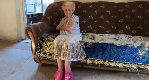 Refugee from Baku Isabella Stepanyan has been living in unfinished house near Stepanakert since 1997, Nagorny Karabakh, August 2016. Photo by Alvard Grigoryan for the 'Caucasian Knot'. Refugee from Baku Isabella Stepanyan has been living in unfinished house near Stepanakert since 1997, Nagorny Karabakh, August 2016. Photo by Alvard Grigoryan for the 'Caucasian Knot'.