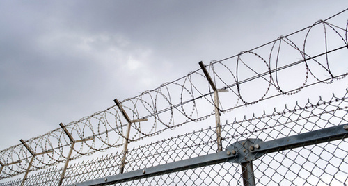 A prison fence. Photo: Thinkstock/Fotobank.ru A prison fence. Photo: Thinkstock/Fotobank.ru