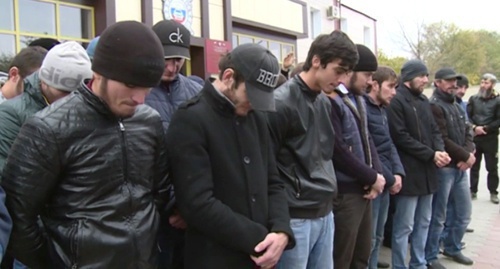 Drivers stand with their heads down while being addressed by Kadyrov. Screenshot of the video record posted on Kadyrov's page in social network vk.com/ramzan