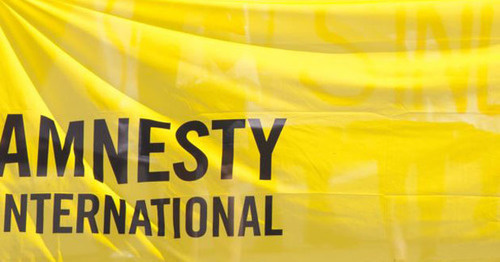 Flag with Amnesty International logo. Photo: RFE/RL