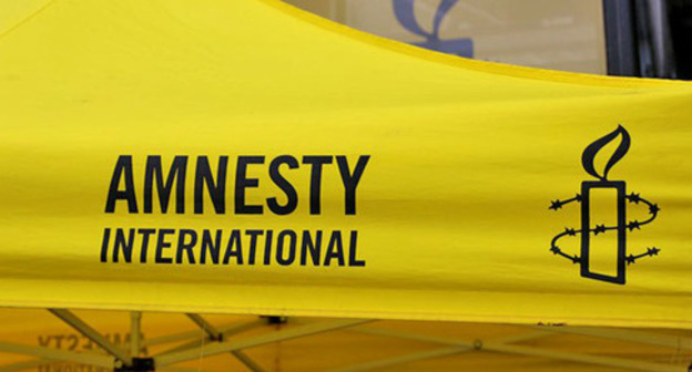 Logo of the international human rights organization "Amnesty International". Photo by the user Metropolico.org flickr.com Logo of the international human rights organization "Amnesty International". Photo by the user Metropolico.org flickr.com