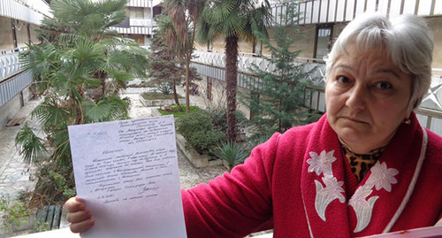 The 10-member Manukov household head shows an application with a request not to evict the family and switch off power supply. Photo by Svetlana Kravchenko for the "Caucasian Knot" The 10-member Manukov household head shows an application with a request not to evict the family and switch off power supply. Photo by Svetlana Kravchenko for the "Caucasian Knot"