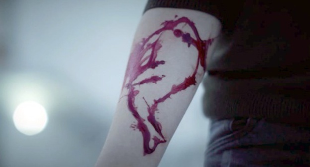 The drawing of a whale on a child's hand. Screenshot of a social advertising "Blue Whale", Youtube.com/watch?v=_tM4w3mo5iQ