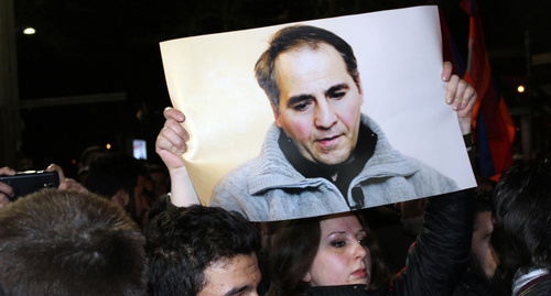The participant of the protest action with the photo of Arthur Sargsyan. Photo by Tigran Petrosyan for "Caucasian Knot"