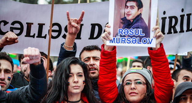 Rally participants hold portrait of political prisoner, Baku, March 2015. Photo by Aziz Karimov for the ‘Caucasian Knot’. 