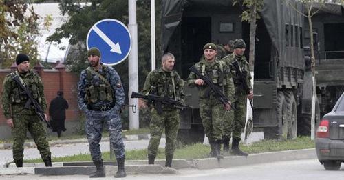 Law enforcers. Photo: REUTERS/Alkhan Gargayev