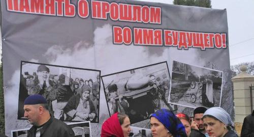 Banner with photos on rehabilitation of repressed nations. Photo: Timur Aklyev (RFE/RL)
