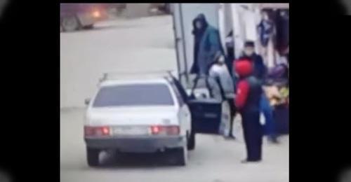 Teenager near the car. Screenshot from video posted by Nurmagomeg Astarkhanov,
https://www.youtube.com/watch?time_continue=34&v=A8kHYg7CJlU
