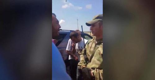 Russian serviceman talks to residents of Panik village, July 18, 2018. Screenshot from video: https://www.facebook.com/100002121814208/videos/vb.100002121814208/1770571256356918/?type=2&video_source=user_video_tab