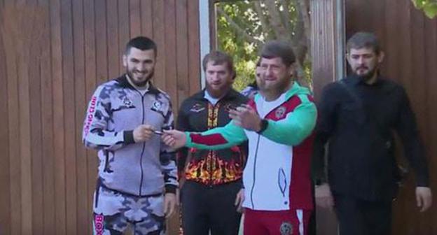 Arthur Beterbiev (from the left) and Ramzan Kadyrov (second from the right). Screenshot of the video by the user Grozny TV Channel https://www.youtube.com/watch?v=guzPGYKihYc Arthur Beterbiev (from the left) and Ramzan Kadyrov (second from the right). Screenshot of the video by the user Grozny TV Channel https://www.youtube.com/watch?v=guzPGYKihYc