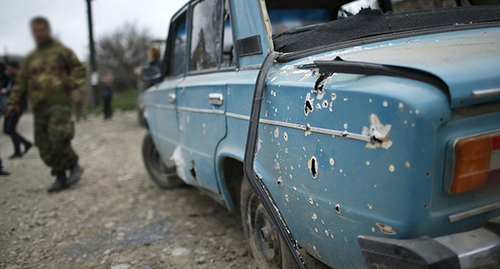 Traces of shelling on a car in the Karabakh conflict zone. Photo: REUTERS/Staff