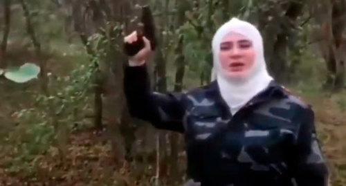 Resident of North Ossetia holding pistol. Screenshot from video posted by 'Chechnya Segodnya' at https://www.youtube.com/watch?time_continue=10&v=nOp1_XDAsSo