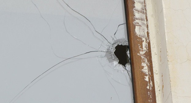 WIndow with traces from exploded shell, Nagorno-Karabakh. Photo by Alvard Grigoryan for the Caucasian Knot
