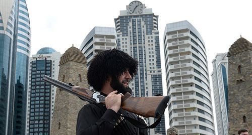 Man wearing national Chechen clothes. Photo: REUTERS/Said Tsarnayev