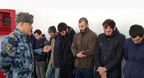 The Minister of the Internal Affairs reproaches the men detained on suspicion of drinking alcoholic beverages and using psychotropic substances, Gudermes District of Chechnya. Photo: official account of Chechen MIA, http://www.instagram.com/p/B5k3-STFR-y/