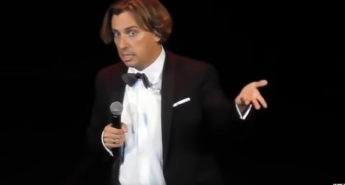 Maxim Galkin during the performance. Screenshot of the video by InformDetox https://www.youtube.com/watch?v=7oKtEYVfSRk&amp;feature=emb_logo