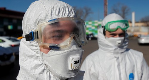 Medical workers in special protective uniform, Moscow, Russia, March 26, 2020. Photo: REUTERS/Maxim Shemetov