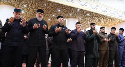 Ramzan Kadyrov and his comrades-in-arms at a collective prayer. Screenshot of the video by the "Grozny" TV Channel