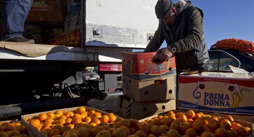 Seller of tangerines at a market in Abkhazia. Photo: REUTERS/Maxim Shemetov
