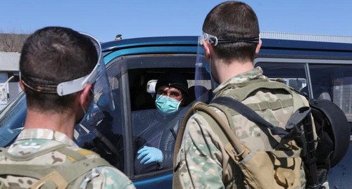 Road checkpoint in Georgia during quarantine. Photo: REUTERS/Irakli Gedenidze