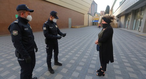Policemen checking IDs, Baku, April 2020. Photo: REUTERS/Aziz Karimov