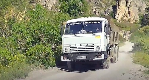 A truck in the Talghi canyon. Screenshot of a video https://www.youtube.com/watch?time_continue=65&amp;v=QpkLKtVpS5E&amp;feature=emb_logo