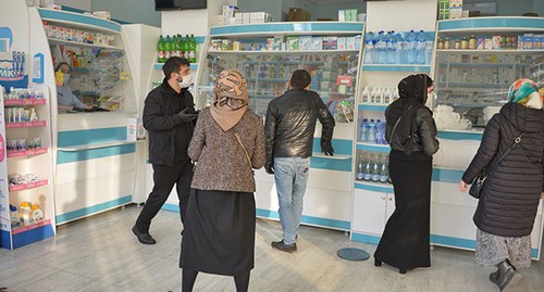 People in a pharmacy in Grozny. Photo: REUTERS/Ramzan Musaev.