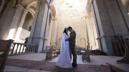 The wedding ceremony of Mariam Sargsyan, a resident of Martuni, and Ovik Ovsepyan, a volunteer of the Defence Army, in the partially destroyed Kazanchetsots Cathedral in the city of Shushi. October 24, 2020. Photo by David Gakhramanyan. Karabakh Information Centre, https://www.facebook.com/ArtsakhInformation/photos/a.104748431165946/200467334927388/?__tn__=%2CO*F