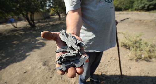 A villager shows shrapnel from the shell. October 19, 2020. Photo by Aziz Karimov for the "Caucasian Knot"