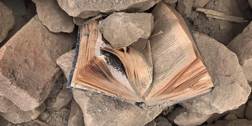 A book under the rubble of a home. November 2020. Photo by Alvard Grigoryan for the "Caucasian Knot"