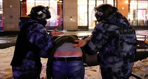 Policemen detain an activist in Moscow, February 2, 2021. Photo: REUTERS/Maxim Shemetov