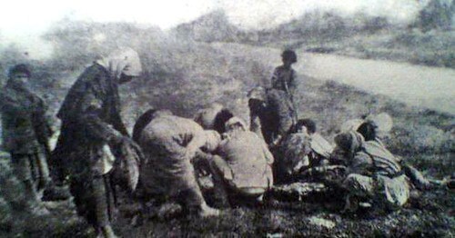 Armenian refugees near a dead horse in the Deir ez-Zor Camps