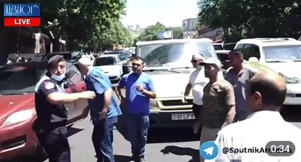 Members of the families of soldiers, missing in action during the autumn war in Nagorno-Karabakh, have blocked Geratsi Street in Yerevan. Screenshot of the video by the "Sputnik Armenia" https://ru.armeniasputnik.am/society/20210531/27747192/Bolee-200-tel-tayno-khranilos-v-kholodilnikakh-rodnye-voennykh-perekryli-ulitsu-v-Erevane.html
