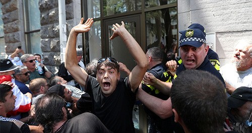 Protesters attack office of the LGBT community during rally against LGBT community's plans to hold “March of Dignity”, July 5, 2021. Photo: REUTERS/Irakli Gedenidze