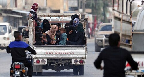 Women and children in a truck. Syria. Photo: REUTERS/Khalil Ashawi