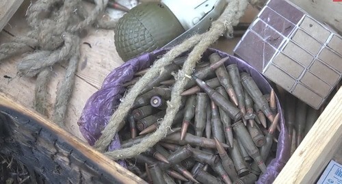 Weapons found by the law enforcers at the shootout venue in a forest near the village of Talgi. Screenshot of the video by the Russian National Antiterrorist Committee (NAC) https://www.youtube.com/watch?v=6YJ01BOmZCY