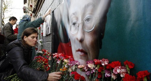 Flowers near the portrait of Anna Politkovskaya. Photo: REUTERS/Denis Sinyakov