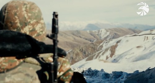 An Armenian soldier in combat position. Screenshot of the video by the press service of the Ministry of Defence of Armenia https://mil.am/hy/news/9921