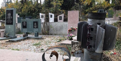 A missile stuck between the graves in the cemetery in Stepanakert in November 2020. Photo by Alvard Grigoryan for the "Caucasian Knot"