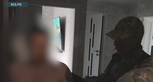 Arrest of a suspect in the case of the attack on Pskov paratroopers in Chechnya. Screenshot of the video by the  the Russian FSB (Federal Security Bureau) https://www.youtube.com/watch?v=zMoZXmcIZDg