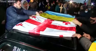 The funeral of Georgian volunteers. Screenshot of the video "Слава Україні! - Героям слава!" https://www.youtube.com/watch?v=n75k3qPRAuo